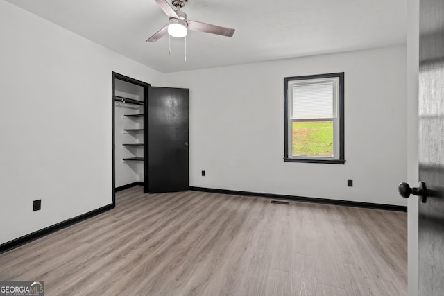 50 Hearthstone Dr, Newnan, GA 30263 - unfurnished bedroom with wood finished floors and ceiling fan
