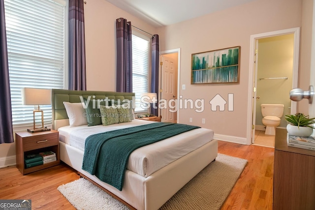 128 Laurel Ridge Dr, Alpharetta, GA 30004 - bedroom with light wood-type flooring and ensuite bath