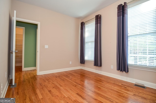 128 Laurel Ridge Dr, Alpharetta, GA 30004 - spare room with light wood-type flooring and baseboards