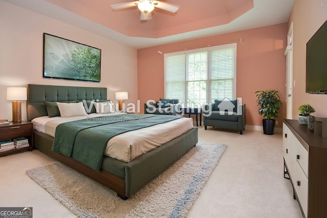 128 Laurel Ridge Dr, Alpharetta, GA 30004 - bedroom featuring light carpet, a tray ceiling, and a ceiling fan