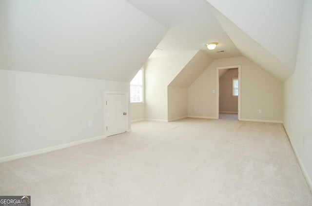 128 Laurel Ridge Dr, Alpharetta, GA 30004 - bonus room featuring light colored carpet, vaulted ceiling, and healthy amount of natural light