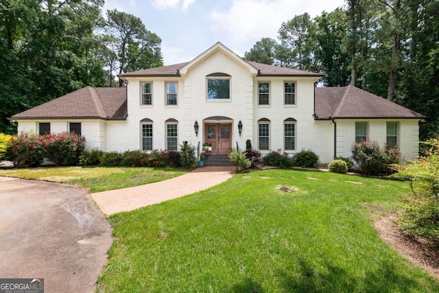 1908 Musket Ct, Stone Mountain, GA 30087 - view of front of house featuring a front yard and roof with shingles