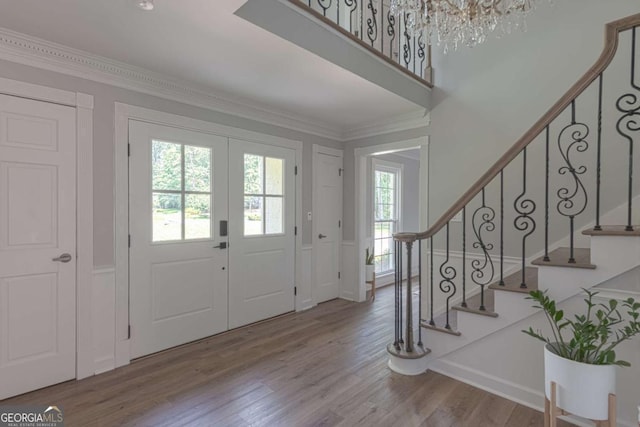 1908 Musket Ct, Stone Mountain, GA 30087 - entryway with wood finished floors, ornamental molding, stairway, and french doors