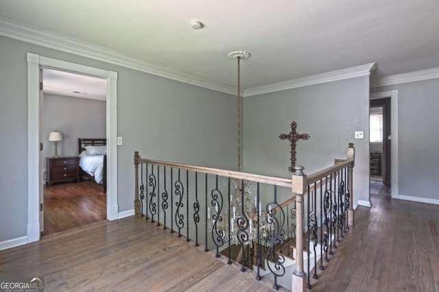 1908 Musket Ct, Stone Mountain, GA 30087 - hall with wood finished floors, an upstairs landing, and crown molding