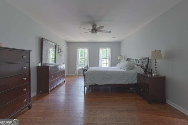 1908 Musket Ct, Stone Mountain, GA 30087 - bedroom with dark wood-style floors and a ceiling fan