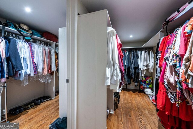 1908 Musket Ct, Stone Mountain, GA 30087 - walk in closet with wood finished floors