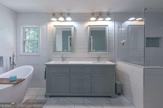 1908 Musket Ct, Stone Mountain, GA 30087 - bathroom with double vanity, tile patterned floors, a freestanding tub, and tiled shower