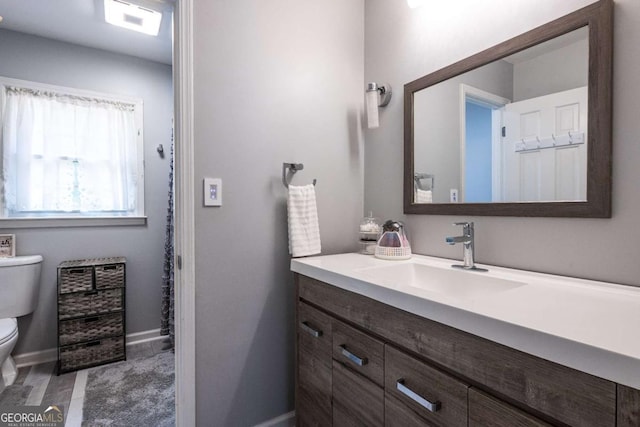 1908 Musket Ct, Stone Mountain, GA 30087 - bathroom with toilet and vanity