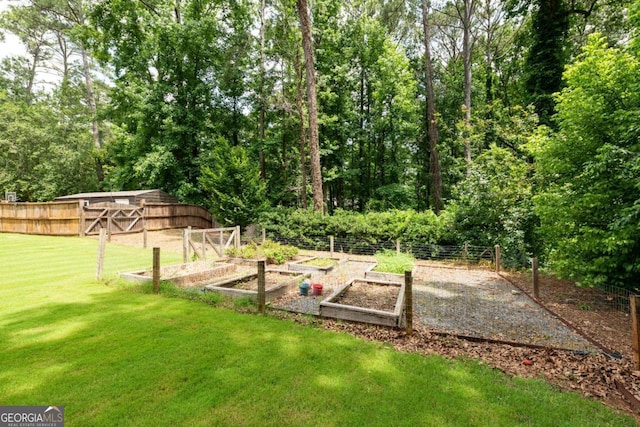 1908 Musket Ct, Stone Mountain, GA 30087 - view of yard featuring a vegetable garden