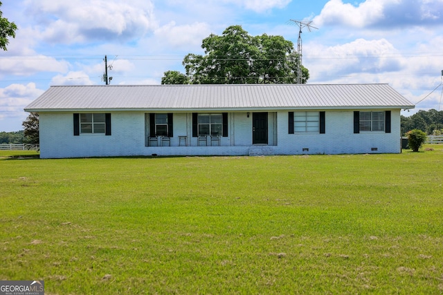 9782 Ga Highway 112, Rochelle, GA 31079 - ranch-style home with brick siding, a metal roof, a front yard, and crawl space