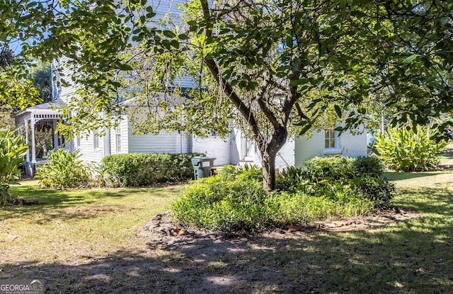 67 Main St, Lumpkin, GA 31815 - view of property exterior featuring a lawn
