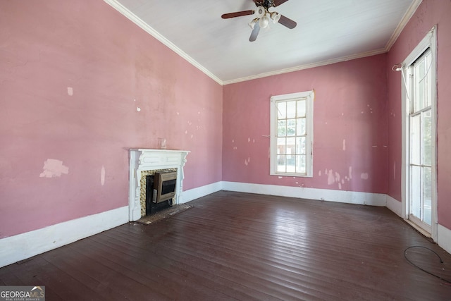67 Main St, Lumpkin, GA 31815 - unfurnished living room featuring wood-type flooring, a ceiling fan, a fireplace with raised hearth, and ornamental molding