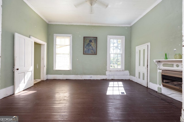 67 Main St, Lumpkin, GA 31815 - unfurnished living room with heating unit, a ceiling fan, plenty of natural light, crown molding, and wood finished floors