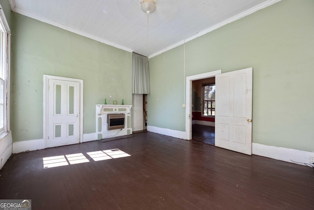 67 Main St, Lumpkin, GA 31815 - unfurnished living room with dark wood-style floors, a fireplace, a high ceiling, and crown molding