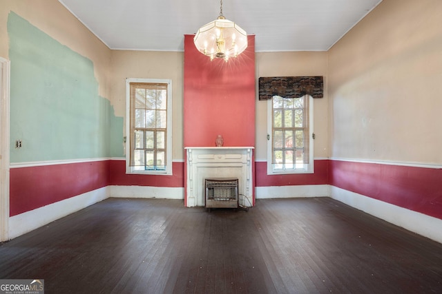 67 Main St, Lumpkin, GA 31815 - unfurnished living room with a chandelier and wood-type flooring