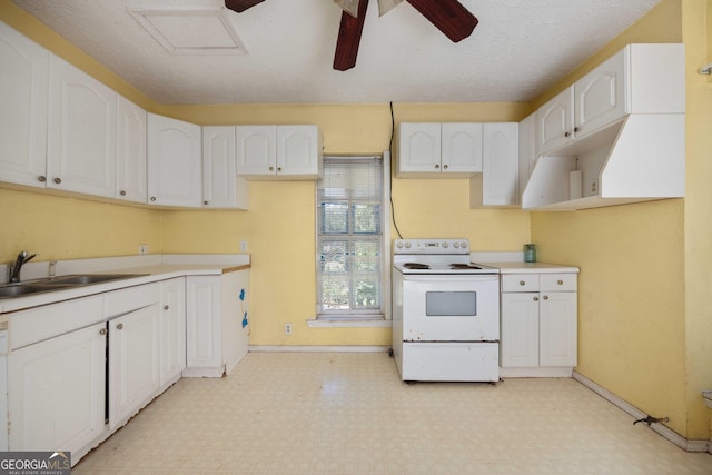67 Main St, Lumpkin, GA 31815 - kitchen with white range with electric stovetop, light flooring, and white cabinetry