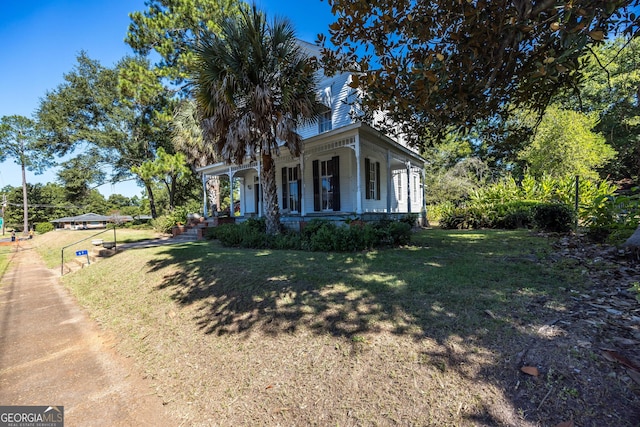 67 Main St, Lumpkin, GA 31815 - view of front of property with a porch and a front yard