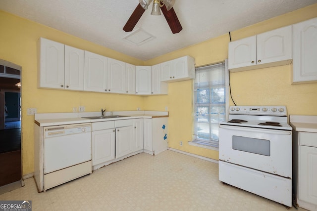 67 Main St, Lumpkin, GA 31815 - kitchen with white appliances, light floors, white cabinets, ceiling fan, and light countertops