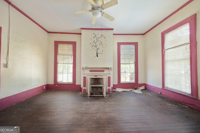 67 Main St, Lumpkin, GA 31815 - unfurnished living room with hardwood / wood-style flooring, plenty of natural light, crown molding, a ceiling fan, and heating unit