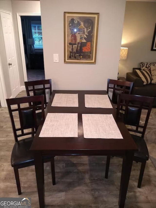 121 N Church St Unit 101, Clayton, GA 30525 - dining space with wood finished floors