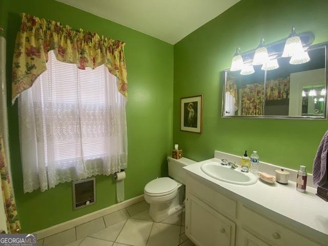 1812 Morgan Cantey Dr, Lanett, AL 36863 - bathroom with vanity, heating unit, and tile patterned floors