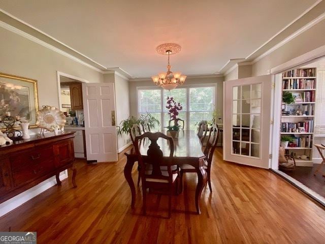 1812 Morgan Cantey Dr, Lanett, AL 36863 - dining area with a chandelier, crown molding, and wood finished floors