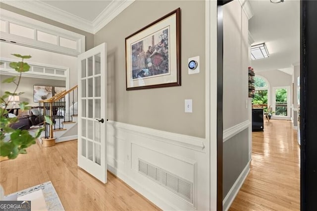 4300 May Apple Dr, Alpharetta, GA 30005 - hall featuring light wood finished floors, ornamental molding, stairway, wainscoting, and french doors