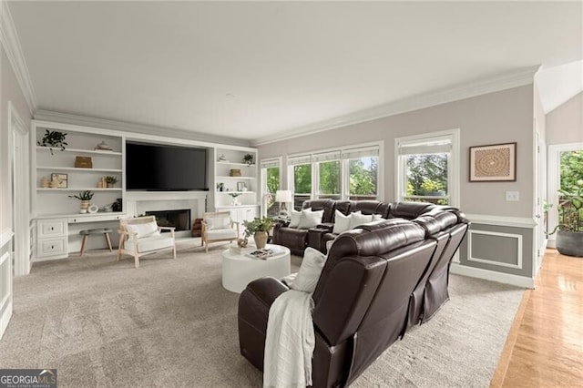 4300 May Apple Dr, Alpharetta, GA 30005 - living room featuring crown molding, healthy amount of natural light, wainscoting, built in features, and a fireplace