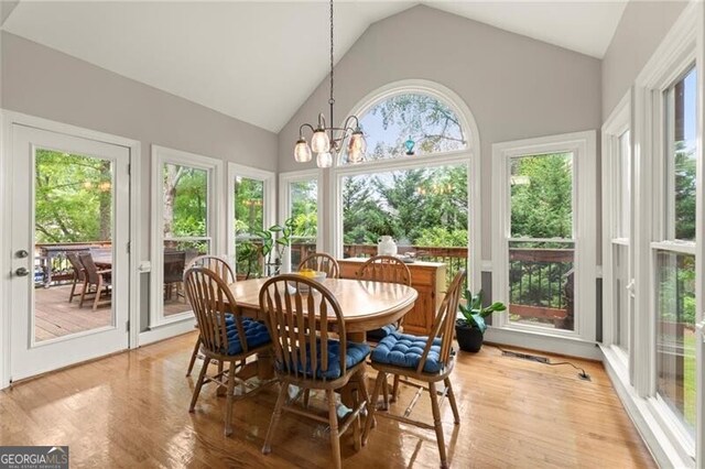 4300 May Apple Dr, Alpharetta, GA 30005 - sunroom / solarium with wood finished floors, a chandelier, and high vaulted ceiling