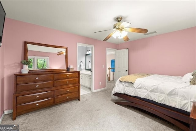 4300 May Apple Dr, Alpharetta, GA 30005 - bedroom featuring light colored carpet, ensuite bath, and ceiling fan