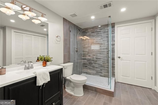 4300 May Apple Dr, Alpharetta, GA 30005 - full bath featuring vanity, a shower stall, recessed lighting, and wood finish floors