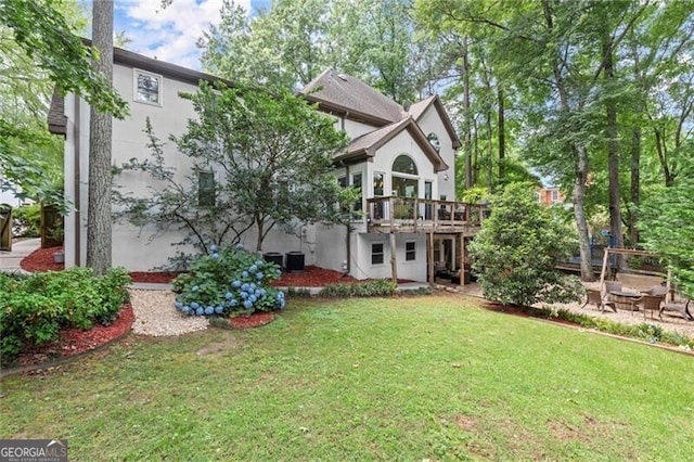 4300 May Apple Dr, Alpharetta, GA 30005 - back of property with a lawn, a deck, and stucco siding