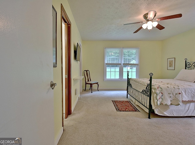 210 Grandchester Way, Fayetteville, GA 30215 - carpeted bedroom featuring a textured ceiling and a ceiling fan