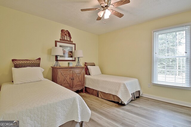 210 Grandchester Way, Fayetteville, GA 30215 - bedroom with light wood finished floors and ceiling fan