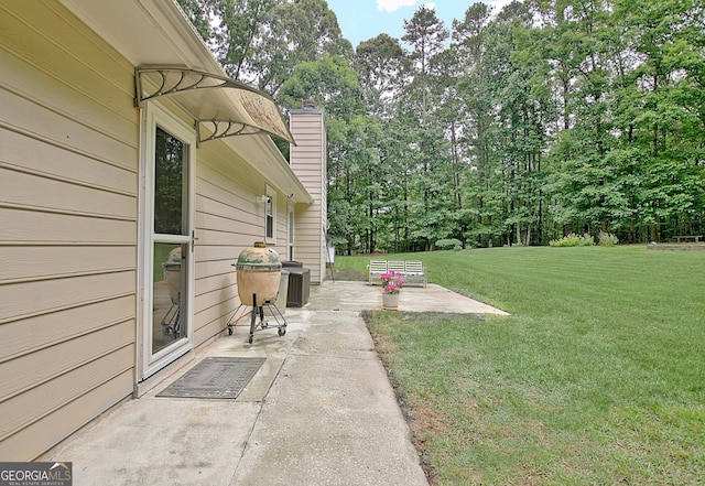 210 Grandchester Way, Fayetteville, GA 30215 - view of grassy yard with a patio area and view of scattered trees