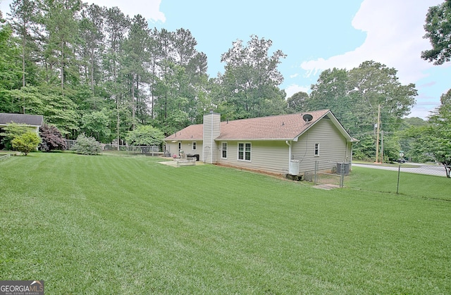 210 Grandchester Way, Fayetteville, GA 30215 - rear view of property featuring a fenced backyard and a chimney