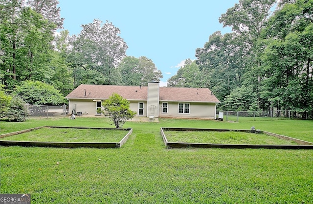 210 Grandchester Way, Fayetteville, GA 30215 - rear view of property featuring a chimney