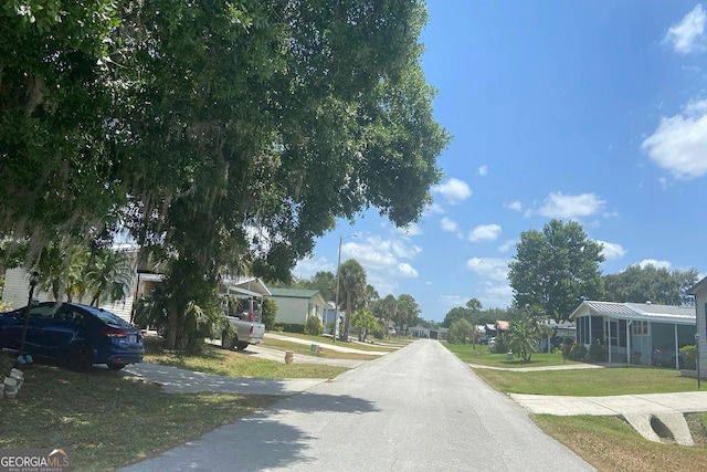 435 Village Cir SW, Winter Haven, FL 33880 - view of asphalt street featuring street lighting and a residential view