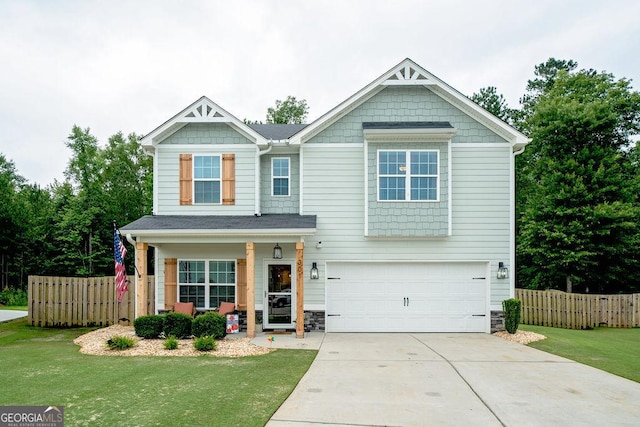 301 Briandwood Dr, Newnan, GA 30265 - craftsman-style home with an attached garage, driveway, a porch, and stone siding