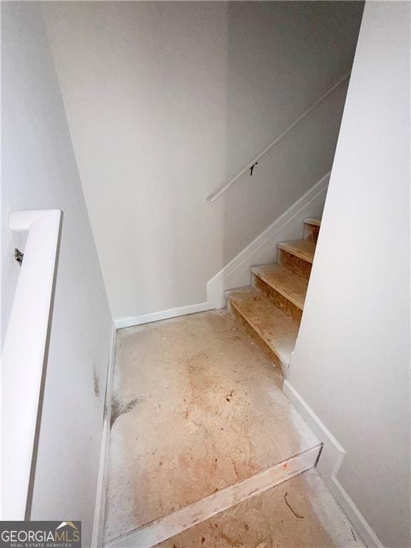 11594 E Lovejoy Rd Unit 1, Hampton, GA 30228 - stairs featuring baseboards