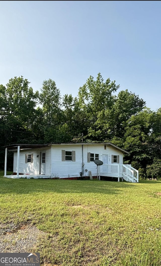 1569 Ga Highway 128, Roberta, GA 31078 - view of front of property with a front yard and a wooden deck