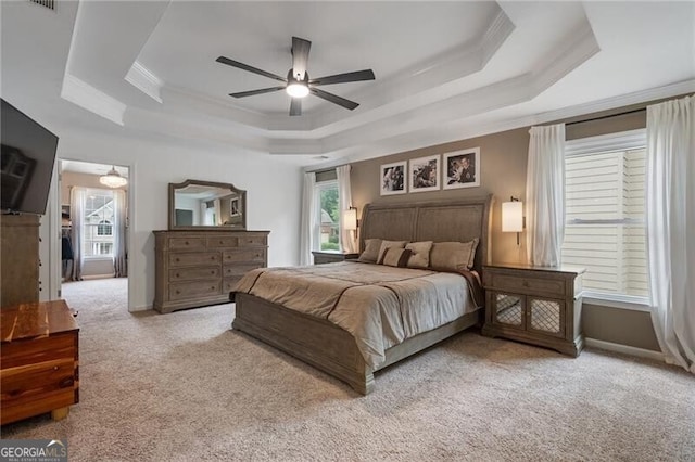 2772 Hillgrove Dr, Dacula, GA 30019 - carpeted bedroom with a tray ceiling, crown molding, multiple windows, and a ceiling fan