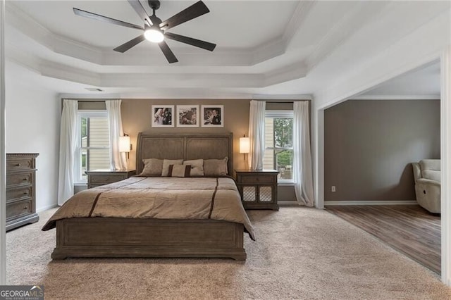 2772 Hillgrove Dr, Dacula, GA 30019 - carpeted bedroom with a tray ceiling, crown molding, and ceiling fan