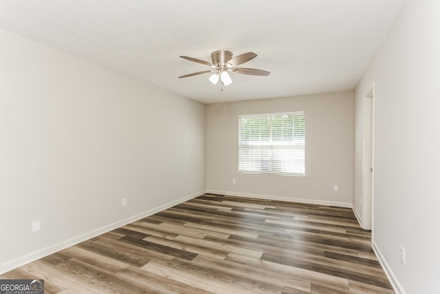 1421 Oak Knoll Dr NE, Conyers, GA 30012 - empty room with ceiling fan, wood finished floors, and a textured ceiling
