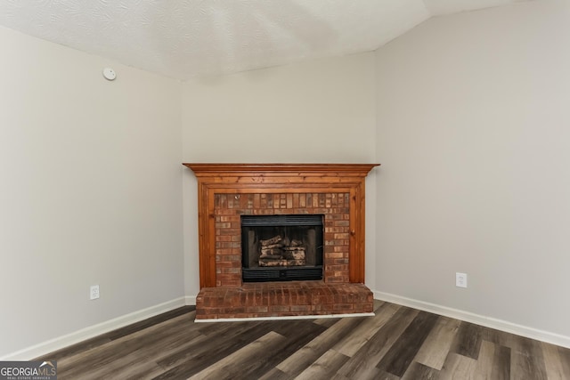 1421 Oak Knoll Dr NE, Conyers, GA 30012 - detailed view of wood finished floors, a fireplace, and a smoke detector