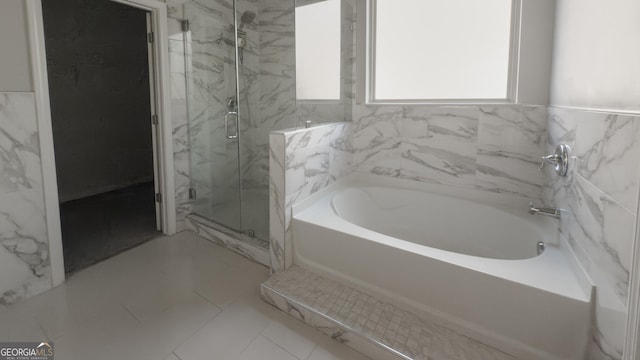 3368 Alhambra Cir, Hampton, GA 30228 - full bathroom with a bath and a marble finish shower
