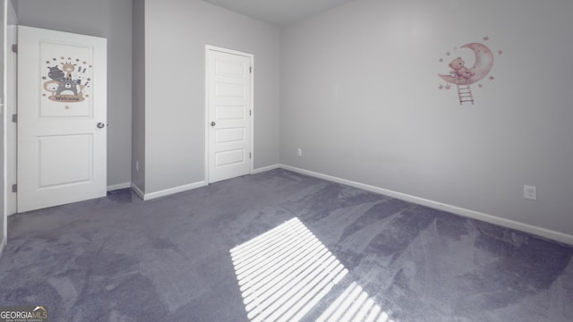 3368 Alhambra Cir, Hampton, GA 30228 - unfurnished bedroom featuring carpet floors and baseboards