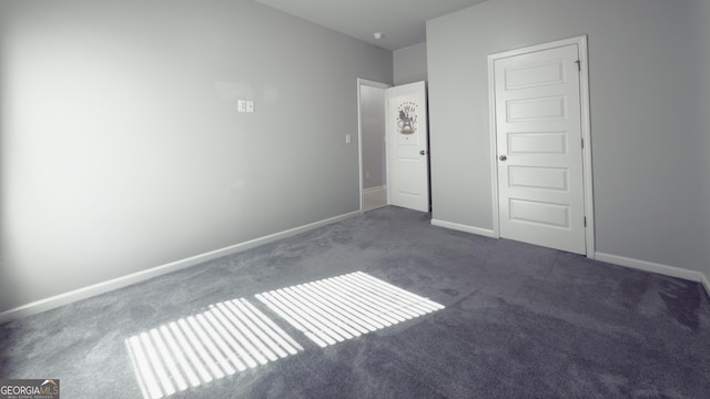 3368 Alhambra Cir, Hampton, GA 30228 - unfurnished bedroom with carpet floors and baseboards