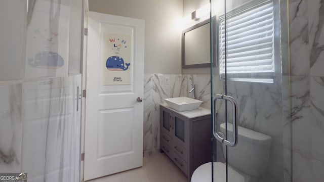 3368 Alhambra Cir, Hampton, GA 30228 - full bath with tile walls, vanity, a marble finish shower, and wainscoting