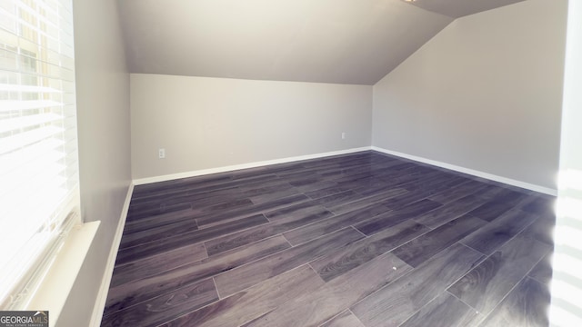 3368 Alhambra Cir, Hampton, GA 30228 - additional living space featuring lofted ceiling and dark wood finished floors